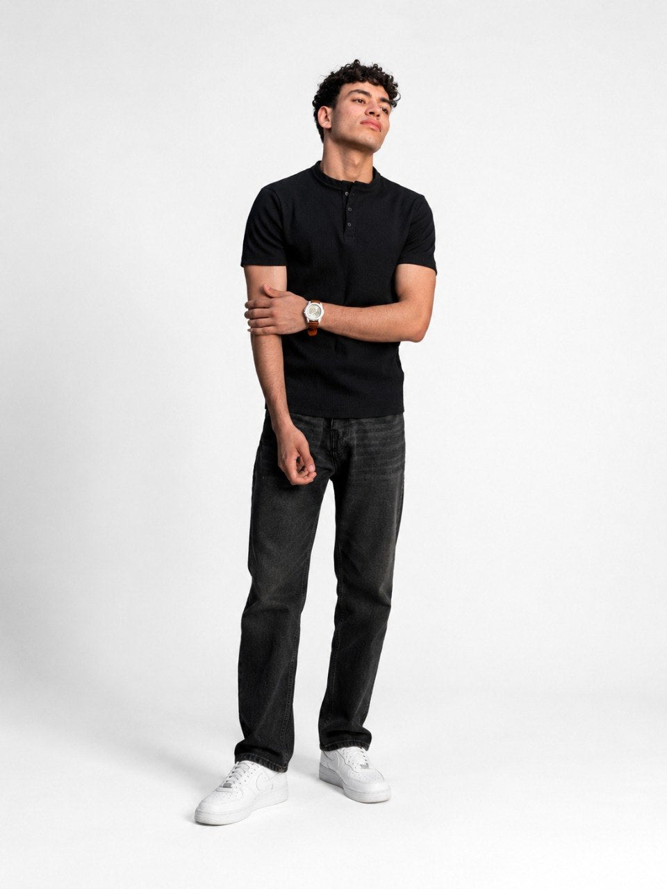 Spring black Henley shirt with buttoned placket and long sleeves, shown flat on a white background.